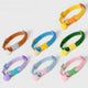 Collection de colliers pour chiot avec boule décorative et boucles de couleurs variées sur fond blanc.